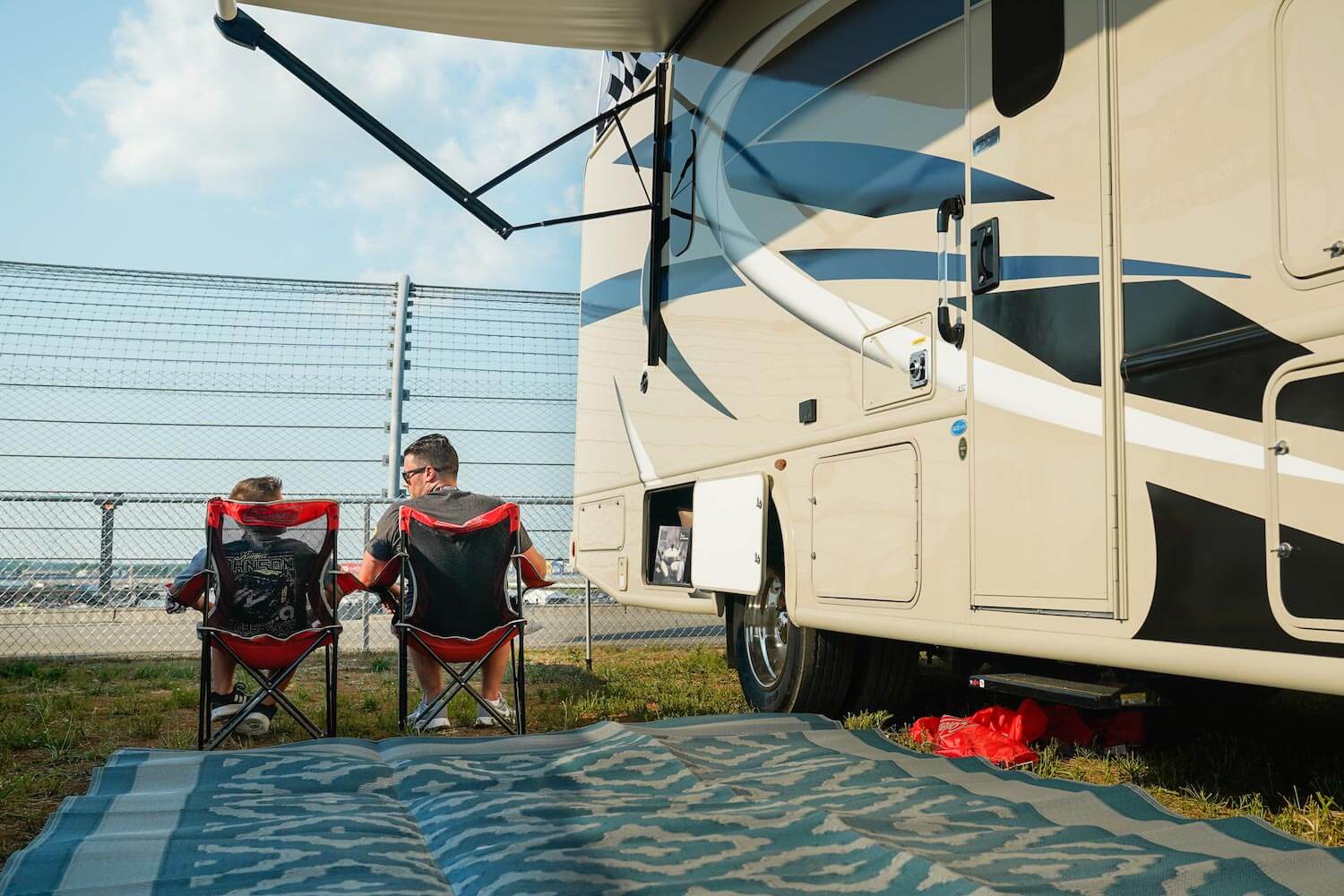 A family enjoying a summer camping trip in a seasonal RV site in Alberta